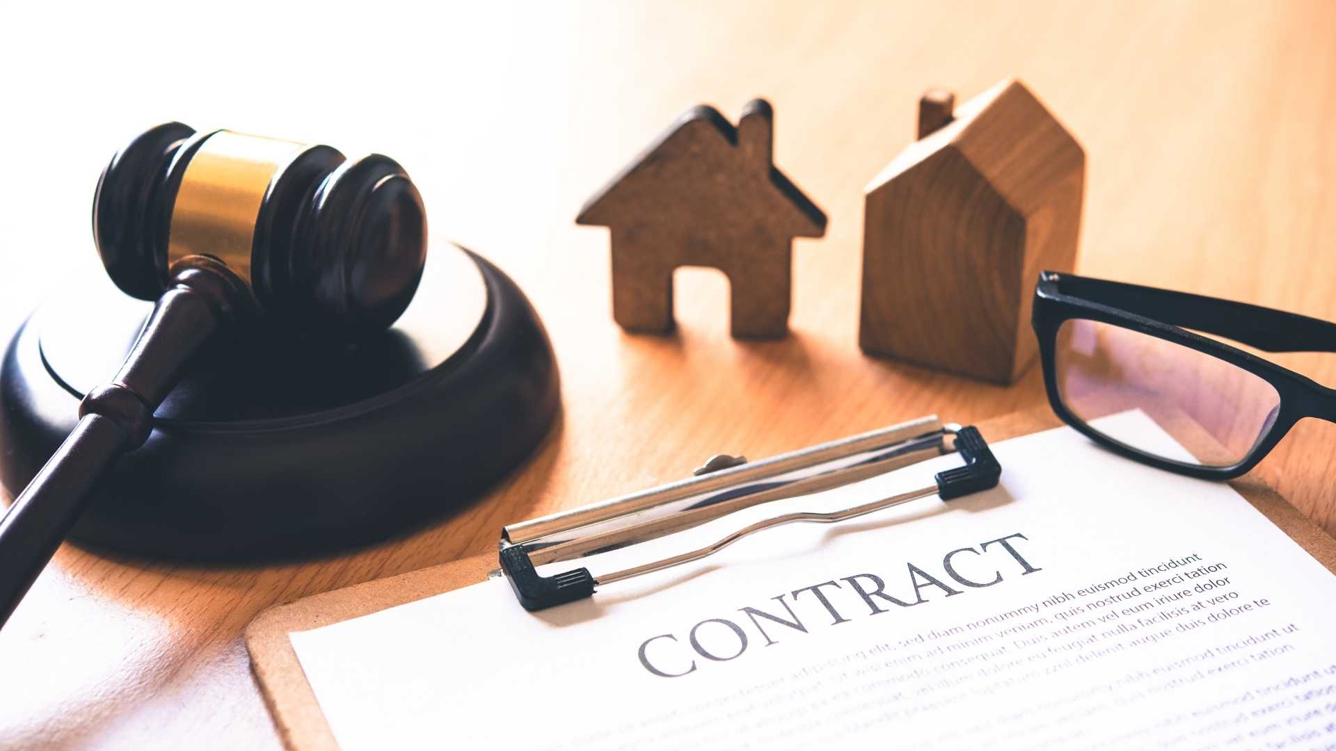 a home figurine and gavel